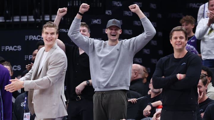 Apr 10, 2026; Salt Lake City, Utah, USA; Utah Jazz forward Lauri Markkanen and center Walker Kessler and head coach Will Hardy react after Utah Jazz guard John Konchar completes a triple double against the Memphis Grizzlies during the second half at Delta Center. Mandatory Credit: Rob Gray-Imagn Images