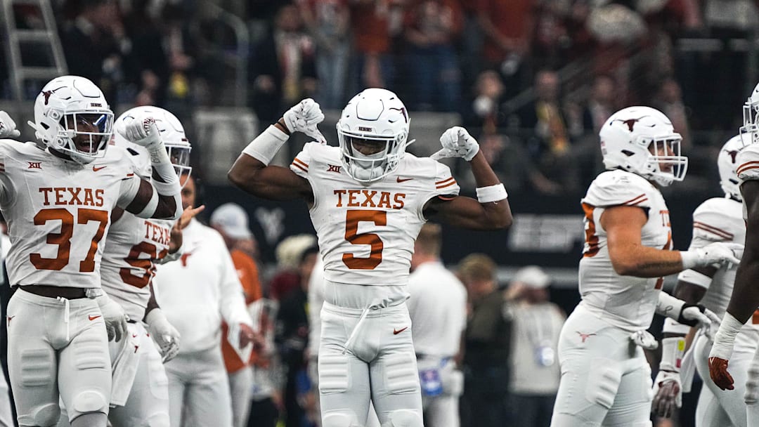 Texas Longhorns defensive back Malik Muhammad (5) celebrates a defensive stop during the Big 12