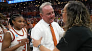 Texas Longhorns head coach Vic Schaefer meets William & Mary head coach Erin Dickerson Davis after the first round NCAA playoff game against William & Mary at the Moody Center on Saturday, March 22, 2025.