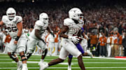 Texas Longhorns running back CJ Baxter (4) runs in for a touchdown during the Sugar Bowl College Football Playoff  semifinals game against the Washington Huskies at the Caesars Superdome on Monday, Jan. 1, 2024 in New Orleans, Louisiana.