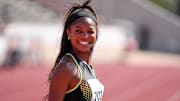 Team USA Red athlete Gabby Thomas (7083) walks the track ahead of the 1600 meter relay invitational at the Clyde Littlefield Texas Relays.