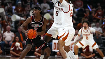 Georgia guard Silas Demary Jr. (5) is guarded by Texas Longhorns forwards Devon Pryor (22) and Arthur Kaluma (6) during the game at the Moody Center on Saturday, March 1, 2025.