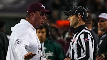Texas A&M head coach Mike Elko argues with an official about an overturned tageting call against the Texas Longhorns during the Lone Star Showdown at Kyle Field on Saturday, Nov. 30, 2024 in College Station, Texas.