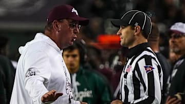 Nov 30, 2024; College Station, Texas, USA; Texas A&M head coach Mike Elko argues with an official about an overturned targeting call against the Texas Longhorns during the Lone Star Showdown at Kyle Field. Mandatory Credit: Sara Diggins/USA TODAY Network via Imagn Images