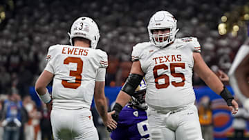 Texas Longhorns offensive lineman Jake Majors (65) celebrates a first down with quarterback Quinn Ewers (3) during the Sugar Bowl College Football Playoff  semifinals game against the Washington Huskies at the Caesars Superdome on Monday, Jan. 1, 2024 in New Orleans, Louisiana.