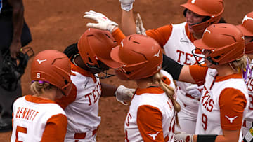 Texas Longhorns infielder Victoria Hunter (12) is greeted by her team at home plate after a home run during the game against Kentucky at Red & Charline McCombs Field on Thursday, May 1, 2025 in Austin.