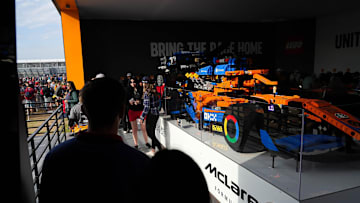 Fans wait in line to take photos of a life-sized LEGO McLaren F1 car in the Grand Plaza at the Formula 1 Pirelli United States Grand Prix at Circuit of the America.