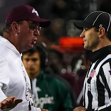 Texas A&M head coach Mike Elko argues with an official about an overturned tageting call against the Texas Longhorns during the Lone Star Showdown at Kyle Field on Saturday, Nov. 30, 2024 in College Station, Texas.