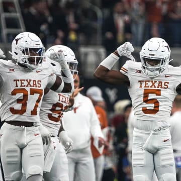 Texas Longhorns defensive back Malik Muhammad (5) celebrates a defensive stop during the Big 12 Championship game against the Oklahoma State Cowboys at AT&T stadium on Saturday, Dec. 2, 2023 in Arlington.