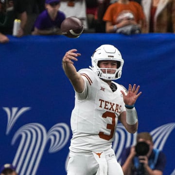 Texas Longhorns quarterback Quinn Ewers (3) throws a pass during the Sugar Bowl College Football Playoff  semifinals game against the Washington Huskies at the Caesars Superdome on Monday, Jan. 1, 2024 in New Orleans, Louisiana.