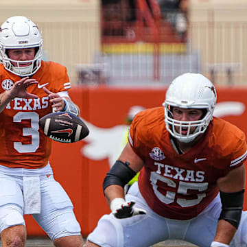 Texas Longhorns quarterback Quinn Ewers (3) snaps the ball during the game against Colorado State at Darrell K Royal-Texas Memorial Stadium in Austin Saturday, Aug. 31, 2024.