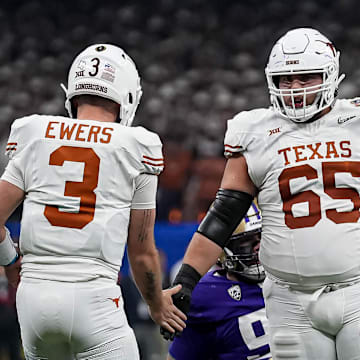 Texas Longhorns offensive lineman Jake Majors (65) celebrates a first down with quarterback Quinn Ewers (3) during the Sugar Bowl College Football Playoff  semifinals game against the Washington Huskies at the Caesars Superdome on Monday, Jan. 1, 2024 in New Orleans, Louisiana.