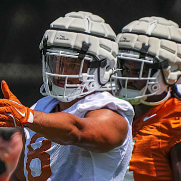 Trey Moore (8) edge for the Texas Longhorns directs team mates during defensive drills at practice at Frank Denius Fields on Thursday, Aug. 1, 2024 in Austin.