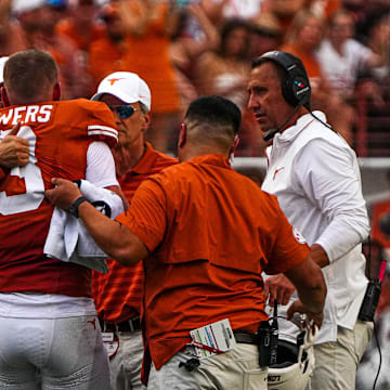 Texas Longhorns quarterback Quinn Ewers (3) is helped off the field after an injury during the game against UTSA at Darrell K Royal-Texas Memorial Stadium in Austin Saturday, Sept. 14, 2024.