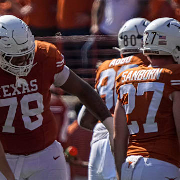 Texas Longhorns offensive lineman Kelvin Banks Jr. (78) hugs kicker Bert Auburn (45) after a field goal against Kansas State at Royal-Memorial Stadium on Saturday, Nov. 4, 2023 in Austin.