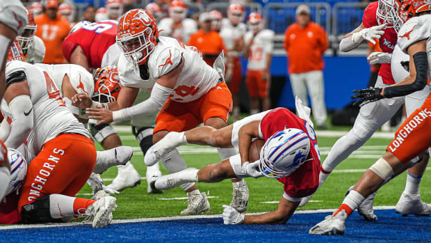 Westlake RB Jack Kayser (33) dives into the endzone for a touchdown against the Laredo United Longhorns on Nov. 25, 2023.