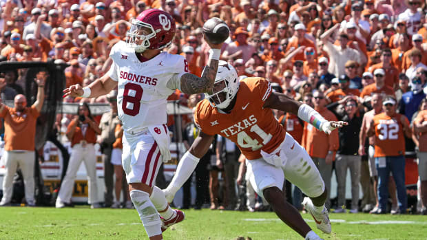 Texas Longhorns lonebacker Jaylan Ford (41) chases Oklahoma quarterback Dillon Gabriel (8) during the game at the Cotton Bowl on Saturday, Oct. 7, 2023 in Dallas, Texas.