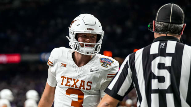 Texas Longhorns quarterback Quinn Ewers (3) talks to an official during the Sugar Bowl College Football Playoff  semifinals game against the Washington Huskies at the Caesars Superdome on Monday, Jan. 1, 2024 in New Orleans, Louisiana.