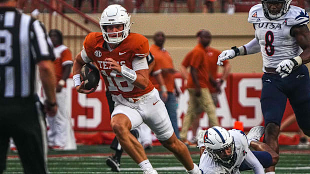 Texas Longhorns quarterback Arch Manning (16) runs the ball during the game against UTSA at Darrell K Royal-Texas Memorial St