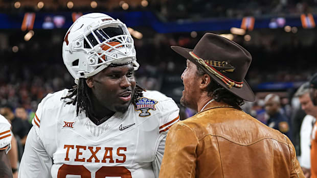 Actor Matthew McConaughey talks to Texas Longhorns defensive lineman T'Vondre Sweat (93) ahead of the Sugar Bowl
