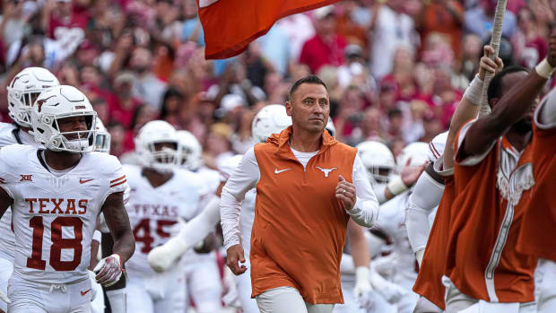 Texas Longhorns head coach Steve Sarkisian leads his team onto the field ahead of the game against