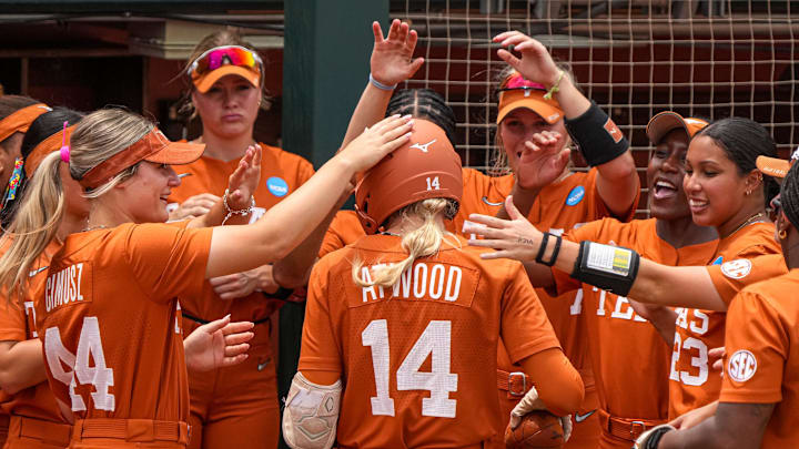 The Texas Longhorns celebrate a home run by Reese Atwood (14) during the NCAA D1 Softball Tournament Regional against UCF at Red and Charline McCombs Field on Sunday, May 18, 2025.