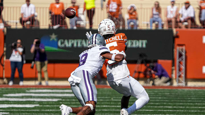 Texas Longhorns wide receiver Adonai Mitchell (5) makes a catch past Kansas State cornerback Will Lee III (8) during the game at Royal-Memorial Stadium on Saturday, Nov. 4, 2023 in Austin.