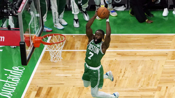 Jun 17, 2024; Boston, Massachusetts, USA; Boston Celtics guard Jaylen Brown (7) dunks against the Dallas Mavericks during the first half in game five of the 2024 NBA Finals at TD Garden. Mandatory Credit: Peter Casey-USA TODAY Sports