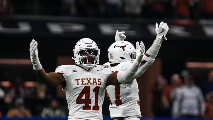 Texas Longhorns linebacker Jaylan Ford (41) celebrates a defensive stop during the Sugar Bowl College Football Playoff  semifinals game against the Washington Huskies at the Caesars Superdome on Monday, Jan. 1, 2024 in New Orleans, Louisiana.