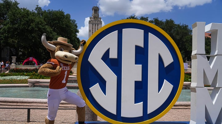 Texas Longhorns mascot Hook 'em poses with the Southeastern Conference logo in front of Littlefield Fountain during the SEC Celebration at the University of Texas at Austin on Sunday, June 30, 2024.