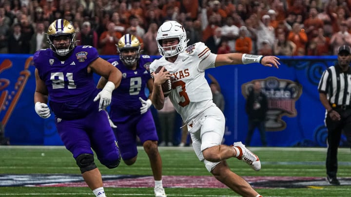 Texas Longhorns quarterback Quinn Ewers (3) runs the ball during the Sugar Bowl College Football Playoff  semifinals game against the Washington Huskies at the Caesars Superdome on Monday, Jan. 1, 2024 in New Orleans, Louisiana.