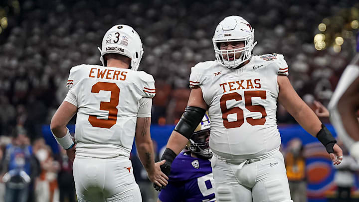 Texas Longhorns offensive lineman Jake Majors (65) celebrates a first down with quarterback Quinn Ewers (3) during the Sugar Bowl College Football Playoff  semifinals game against the Washington Huskies at the Caesars Superdome on Monday, Jan. 1, 2024 in New Orleans, Louisiana.