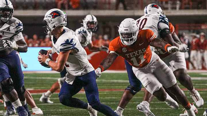 Texas Longhorns edge Colin Simmons (11) pressures UTSA quarterback Owen McCown (2) during the game at Darrell K Royal-Texas Memorial Stadium in Austin Saturday, Sept. 14, 2024.