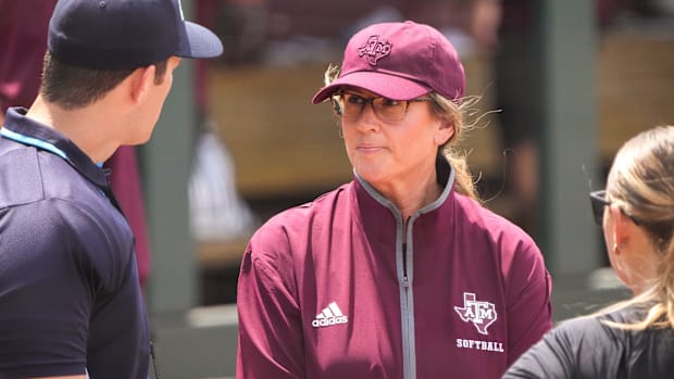 exas A&M head coach Trisha Ford talks to officials ahead of the NCAA D1 Softball Tournament Regional.