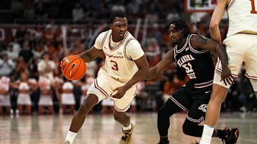 Texas Longhorns guard Max Abmas (3) pushes past Oklahoma State guard John-Michael Wright (51) during the basketball game at the Moody Center on Saturday, Mar. 2, 2024 in Austin.
