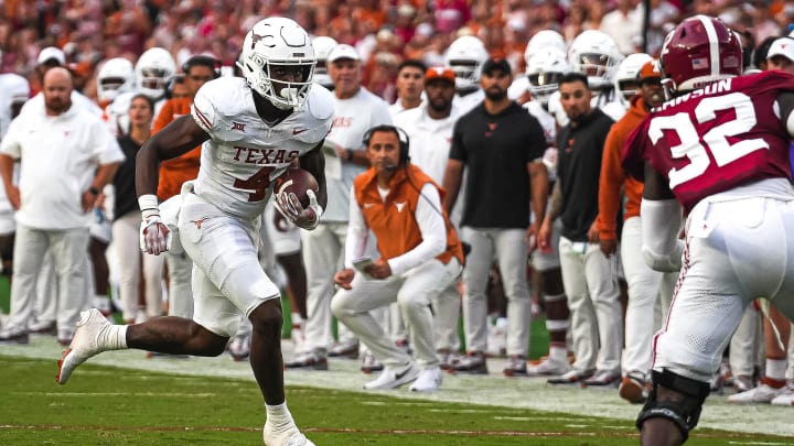 Sep. 9, 2023; Tuscaloosa, Alabama; Texas Longhorns running back CJ Baxter (4) runs the ball during the game against Alabama at Bryant-Denny Stadium on Saturday, Sep. 9, 2023 in Tuscaloosa, Alabama. Mandatory Credit: Aaron E. Martinez-USA TODAY NETWORK