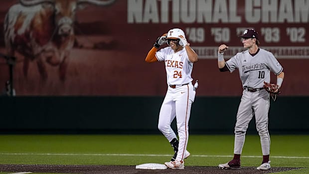 Texas A&M infielder Ben Royo (10) celebrates tagging out Texas Longhorns infielder Adrian Rodriguez (24) during the Lone Star