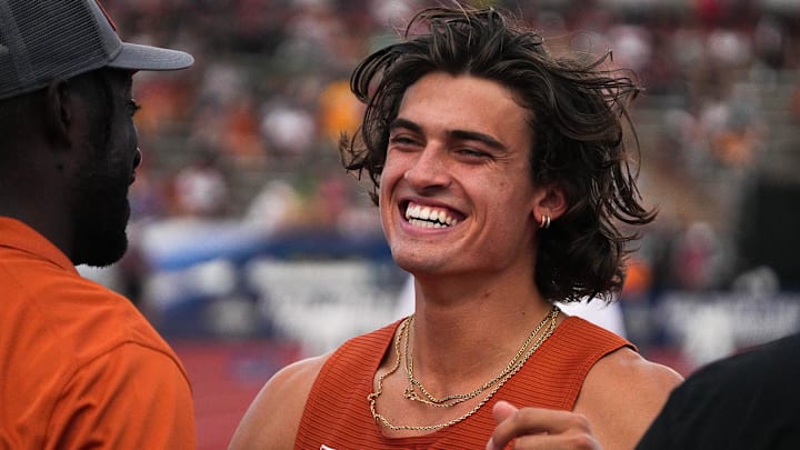 Jun 9, 2023; Austin, TX, USA; Texas athlete Sam Hurley runs to hug a coach before competing in high jump finals at the 2023 NCAA outdoor track and field championships at Mike A. Myers Stadium. Mandatory Credit: Aaron E. Martinez-Imagn Images