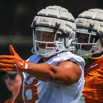 Trey Moore (8) edge for the Texas Longhorns directs team mates during defensive drills at practice at Frank Denius Fields on Thursday, Aug. 1, 2024 in Austin.