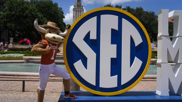 Texas Longhorns mascot Hook 'em poses with the Southeastern Conference logo in front of Littlefield Fountain during the SEC Celebration at the University of Texas at Austin on Sunday, June 30, 2024.