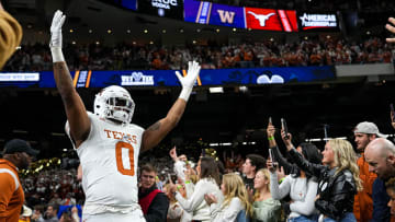Texas Longhorns tight end Ja'Tavion Sanders (0) hypes up the crowd as he takes the field ahead of the Sugar Bowl College Football Playoff  semifinals game against the Washington Huskies at the Caesars Superdome on Monday, Jan. 1, 2024 in New Orleans, Louisiana.