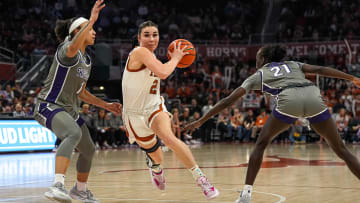 Texas Longhorns guard Shaylee Gonzales (2) pushes past Kansas State guard Zyanna Walker (1) during