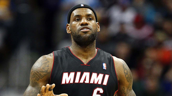 Dec 30, 2013; Denver, CO, USA; Miami Heat small forward LeBron James (6) controls the ball in the third quarter against the Denver Nuggets at the Pepsi Center. The Heat defeated the Nuggets 97-94. Mandatory Credit: Isaiah J. Downing-Imagn Images
