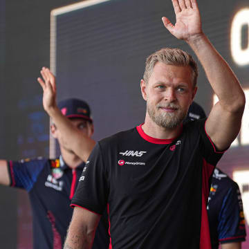 MoneyGram Haas driver Kevin Magnussen waves to the crowd as he leaves the stage during driver engagements in the Germania Insurance Amphitheater at Circuit of Americas on Saturday Oct. 21, 2023 ahead of the Formula 1 Lenovo United States Grand Prix on Sunday.