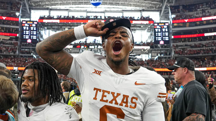 Texas Longhorns quarterback Maalik Murphy (6) celebrates the Longhorns' 49-21 win over Oklahoma State in the Big 12 Championship game at AT&T stadium on Saturday, Dec. 2, 2023 in Arlington.