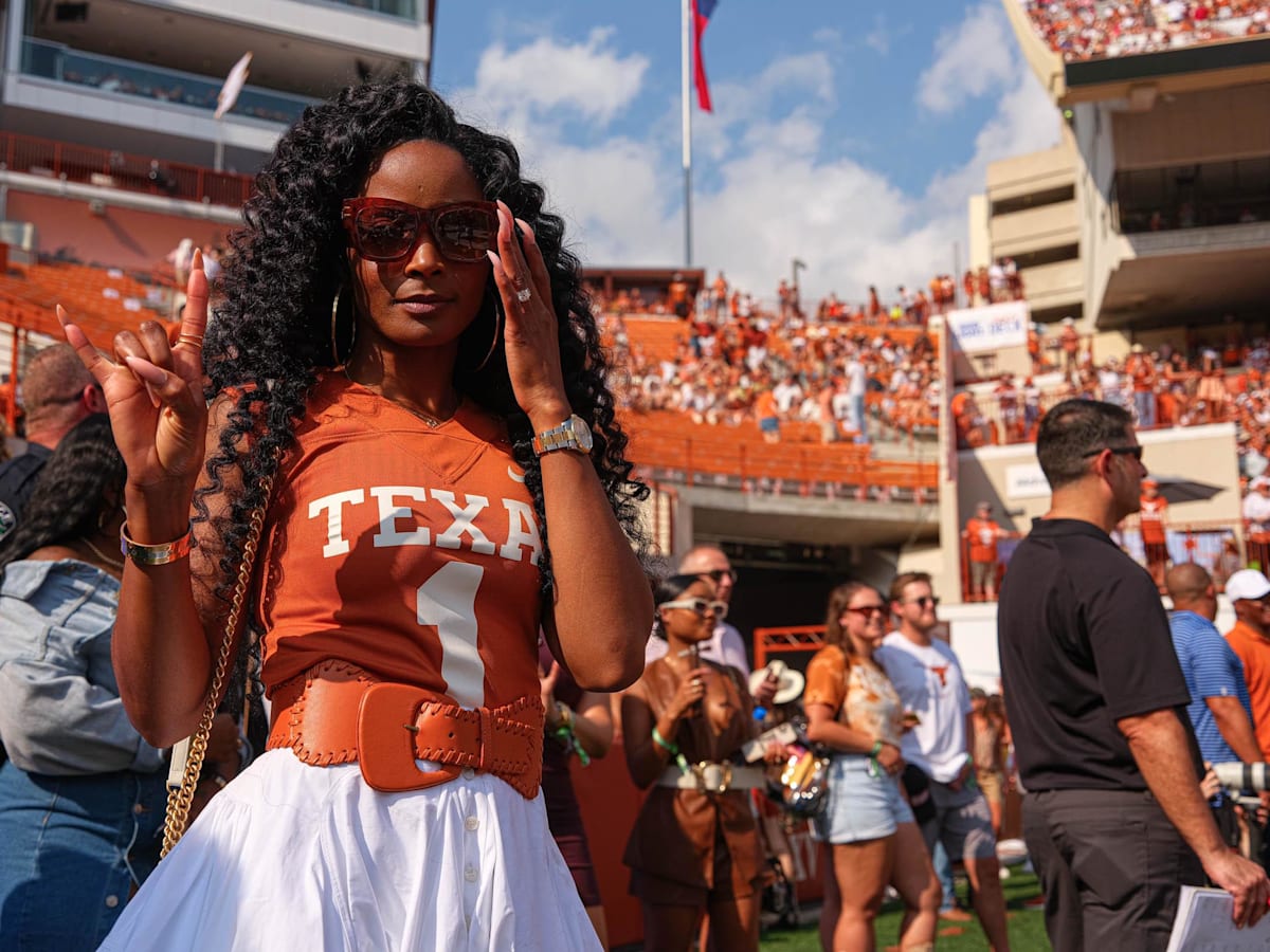 Loreal Sarkisian shows out in vibrant pink and orange set for Texas vs Georgia game