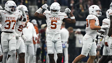 Texas Longhorns defensive back Malik Muhammad (5) celebrates a defensive stop during the Big 12 Championship game against the Oklahoma State Cowboys at AT&T stadium on Saturday, Dec. 2, 2023 in Arlington.