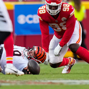 Cincinnati Bengals quarterback Joe Burrow (9) fumbles the ball before it was returned for a touchdown by Kansas City Chiefs safety Chamarri Conner (27) in the fourth quarter of the NFL Week 2 game between the Kansas City Chiefs and the Cincinnati Bengals at Arrowhead Stadium in Kansas City on Sunday, Sept. 15, 2024. The Chiefs took a 26-25 win with a go-ahead field goal as time expired.