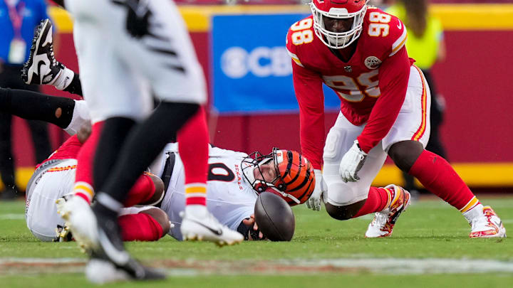 Cincinnati Bengals quarterback Joe Burrow (9) fumbles the ball before it was returned for a touchdown by Kansas City Chiefs safety Chamarri Conner (27) in the fourth quarter of the NFL Week 2 game between the Kansas City Chiefs and the Cincinnati Bengals at Arrowhead Stadium in Kansas City on Sunday, Sept. 15, 2024. The Chiefs took a 26-25 win with a go-ahead field goal as time expired.