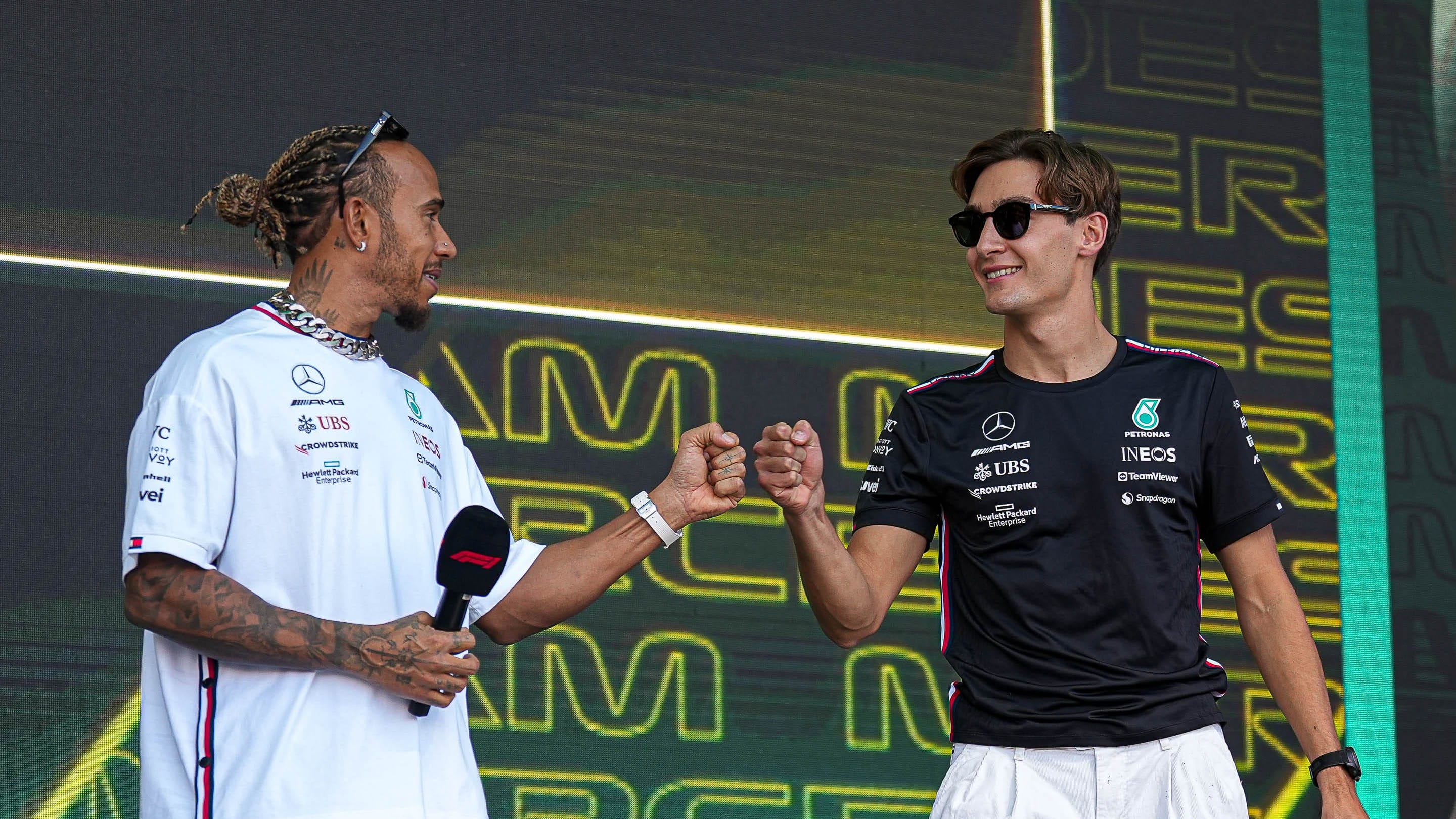 Mercedes AMG Petronas driver Lewis Hamilton greets Mercedes AMG Petronas driver George Russell as he